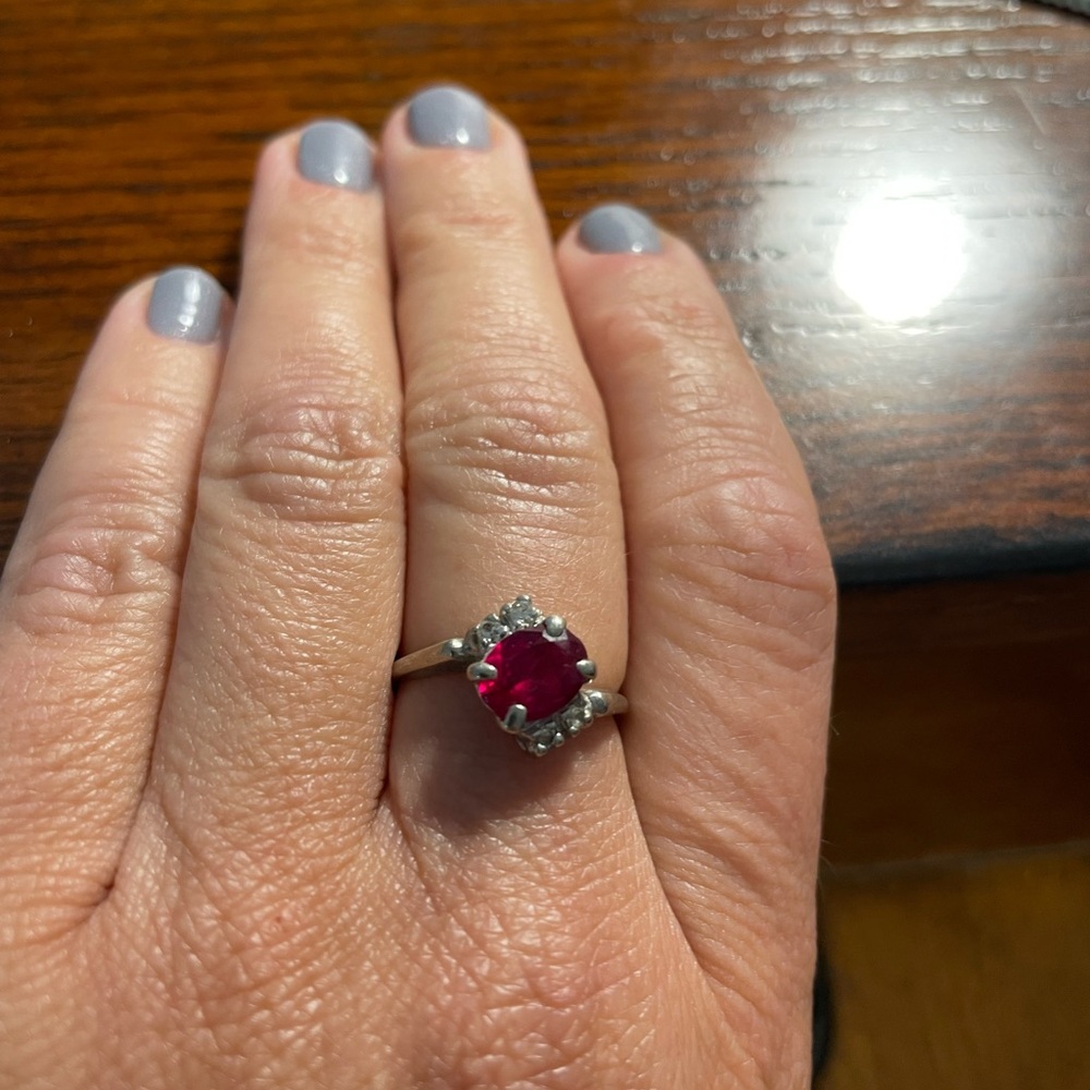 10k white gold ring with red stone